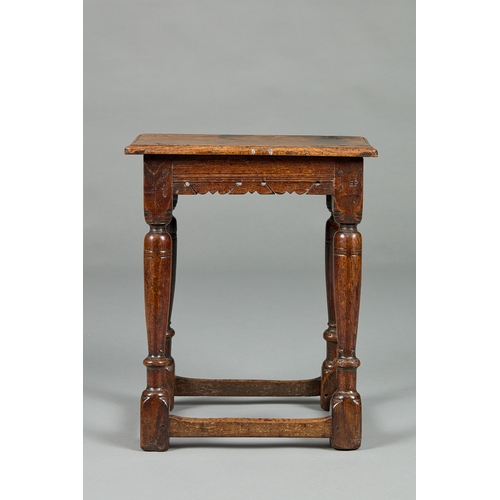 28 - A FINE ELIZABETH I CARVED OAK JOINT STOOL, ENGLISH CIRCA 1590-1600. The moulded plank top above shap... 