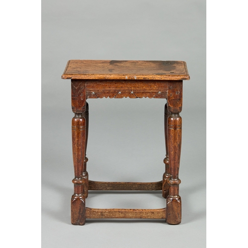 28 - A FINE ELIZABETH I CARVED OAK JOINT STOOL, ENGLISH CIRCA 1590-1600. The moulded plank top above shap... 