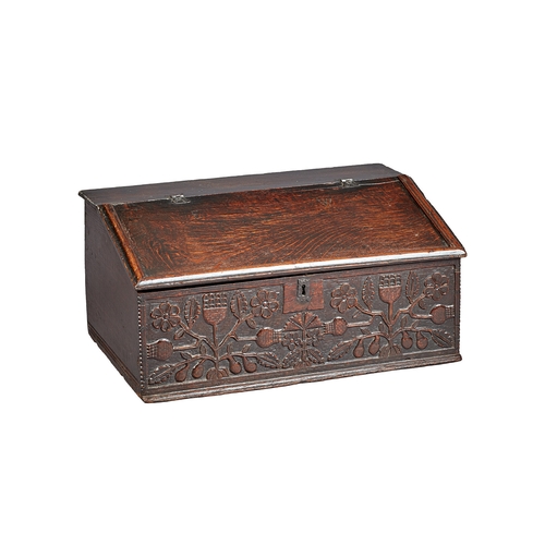 3 - A FINE CHARLES II OAK DESK /WRITING BOX, CARVED WITH THISTLES LANCASHIRE, CIRCA 1660-1670. The high-... 