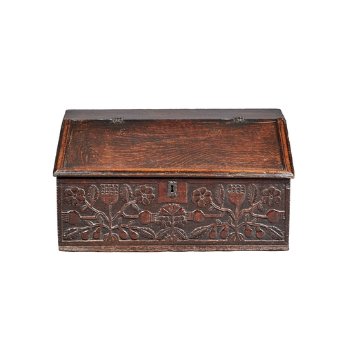 3 - A FINE CHARLES II OAK DESK /WRITING BOX, CARVED WITH THISTLES LANCASHIRE, CIRCA 1660-1670. The high-... 