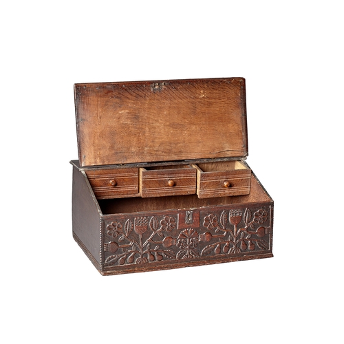 3 - A FINE CHARLES II OAK DESK /WRITING BOX, CARVED WITH THISTLES LANCASHIRE, CIRCA 1660-1670. The high-... 