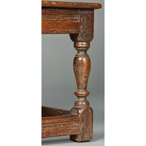 39 - A RARE AND UNUSUAL ELIZABETHAN OAK LOW SEATED BACKSTOOL CHILDS CHAIR, ENGLISH, CIRCA 1580-1600. With... 