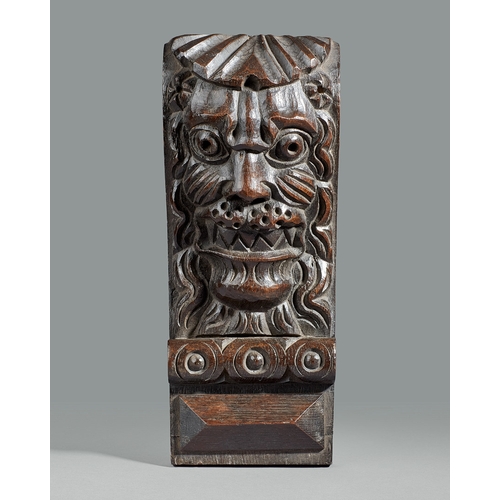 40 - A GROUP OF THREE ELIZABETHAN CARVED OAK CORBELS, CIRCA 1590. The corbels boldly carved with a Lion m... 