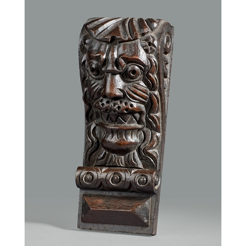 40 - A GROUP OF THREE ELIZABETHAN CARVED OAK CORBELS, CIRCA 1590. The corbels boldly carved with a Lion m... 