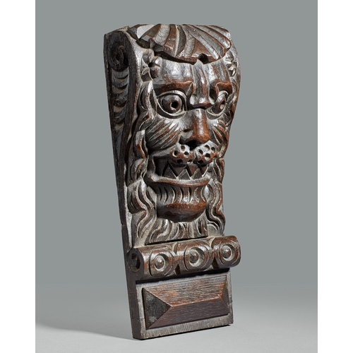 40 - A GROUP OF THREE ELIZABETHAN CARVED OAK CORBELS, CIRCA 1590. The corbels boldly carved with a Lion m... 