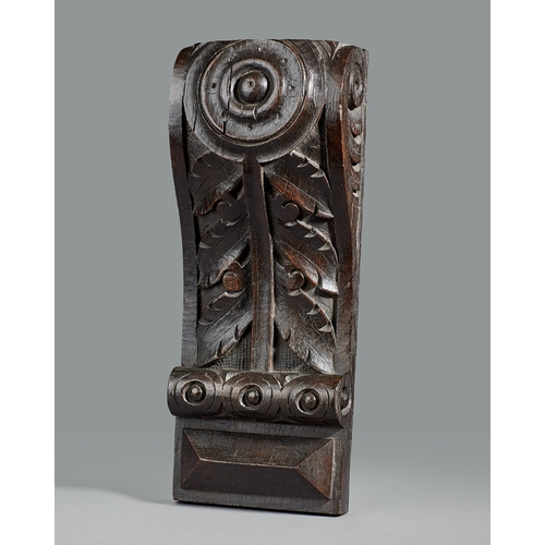 40 - A GROUP OF THREE ELIZABETHAN CARVED OAK CORBELS, CIRCA 1590. The corbels boldly carved with a Lion m... 