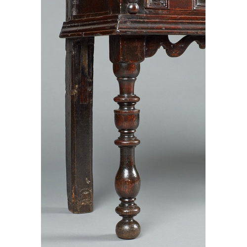 42 - A SMALL CHARLES II OAK AND ELM DRESSER BASE, CIRCA 1670-1680. The twin Elm plank top of exceptional ... 