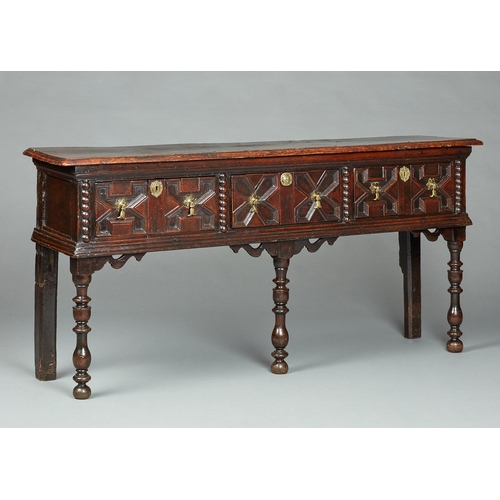 42 - A SMALL CHARLES II OAK AND ELM DRESSER BASE, CIRCA 1670-1680. The twin Elm plank top of exceptional ... 