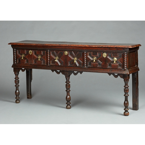 42 - A SMALL CHARLES II OAK AND ELM DRESSER BASE, CIRCA 1670-1680. The twin Elm plank top of exceptional ... 