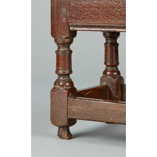 48 - A FINE CHARLES I OAK LOW OR CHILDS JOINED STOOL, ENGLISH, CIRCA 1630-1640. The bold moulded top with... 