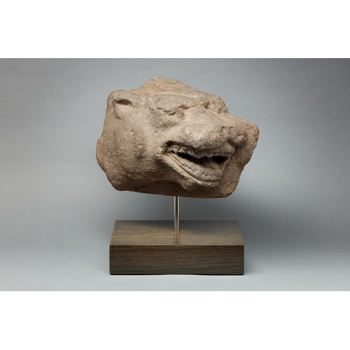 57 - A MID 15TH CENTURY GRITSTONE HEAD OF A LEOPARD, ENGLISH, STAFFORDSHIRE, CIRCA 1450-1460. A threequar... 