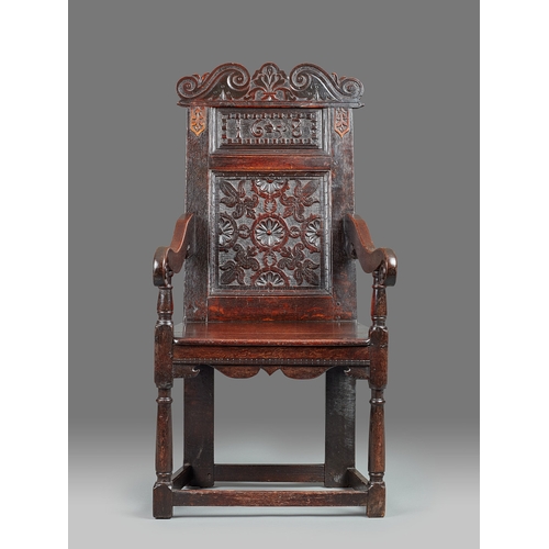 59 - AN EXCEPTIONAL QUALITY CHARLES I OAK ARMCHAIR, DERBYSHIRE, DATED 1638. The tall armchair with twin f... 