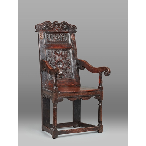 59 - AN EXCEPTIONAL QUALITY CHARLES I OAK ARMCHAIR, DERBYSHIRE, DATED 1638. The tall armchair with twin f... 