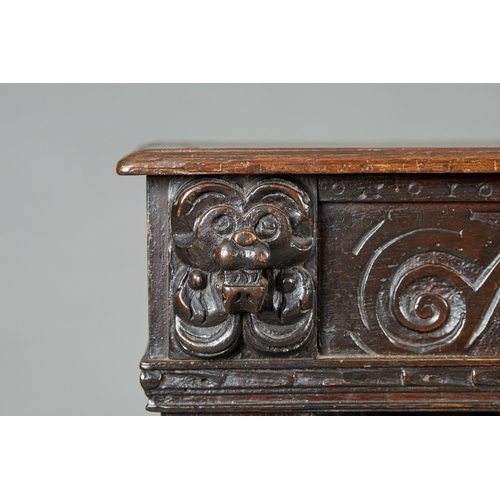 60 - AN ELIZABETH I OAK CANTED LIVERY CUPBOARD, GLOUCESTERSHIRE, CIRCA 15901600. The canted upper sectio... 