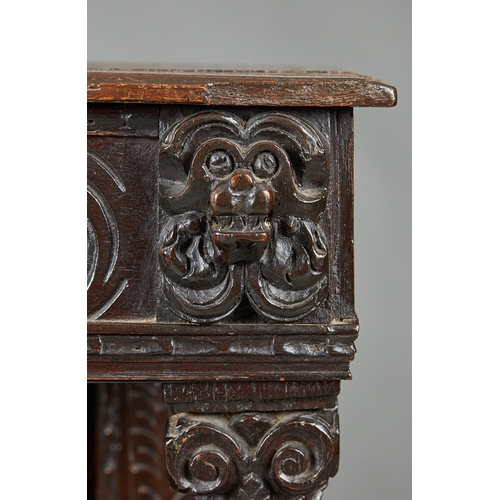 60 - AN ELIZABETH I OAK CANTED LIVERY CUPBOARD, GLOUCESTERSHIRE, CIRCA 15901600. The canted upper sectio... 