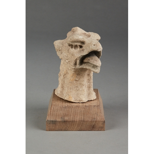 61 - A RARE MEDIEVAL 15TH CENTURY OOLITIC FOSSIL LIMESTONE GRIFFIN HEAD, ENGLISH, CIRCA 1400-1450. The sc... 