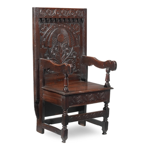 63 - A RARE MID 17TH CENTURY OAK TABLE CHAIR, SOUTH LANCASHIRE/CHESHIRE, CIRCA 1640-1660. The twin board ... 