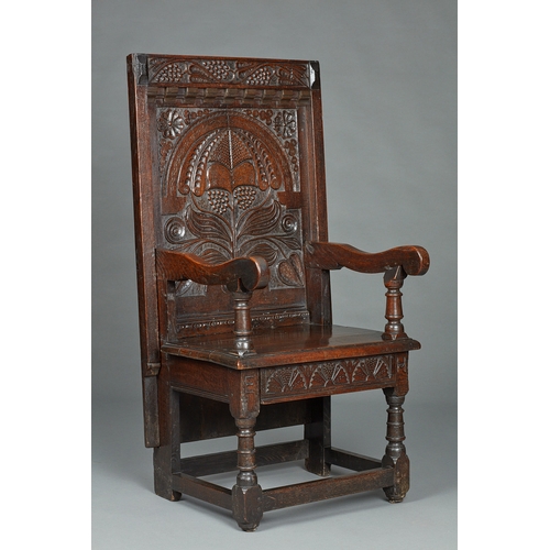 63 - A RARE MID 17TH CENTURY OAK TABLE CHAIR, SOUTH LANCASHIRE/CHESHIRE, CIRCA 1640-1660. The twin board ... 