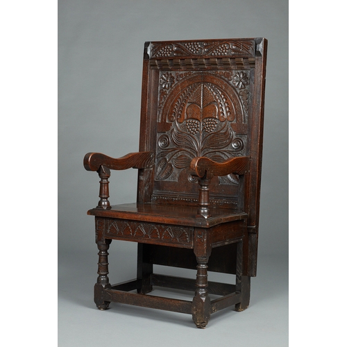 63 - A RARE MID 17TH CENTURY OAK TABLE CHAIR, SOUTH LANCASHIRE/CHESHIRE, CIRCA 1640-1660. The twin board ... 