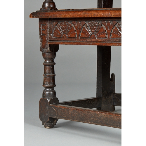 63 - A RARE MID 17TH CENTURY OAK TABLE CHAIR, SOUTH LANCASHIRE/CHESHIRE, CIRCA 1640-1660. The twin board ... 