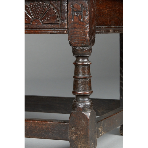 63 - A RARE MID 17TH CENTURY OAK TABLE CHAIR, SOUTH LANCASHIRE/CHESHIRE, CIRCA 1640-1660. The twin board ... 