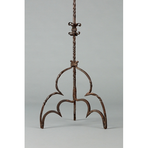 71 - AN ELIZABETHAN WROUGHT IRON CANDELABRA, ENGLISH, CIRCA 1580-1600. Having a single pricket above four... 