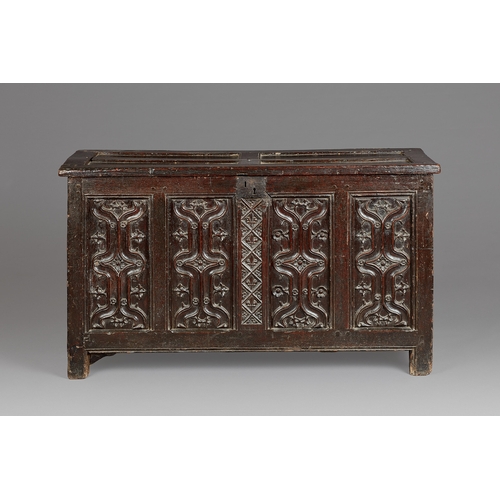 79 - A FINE AND EXTREMELY RARE ENGLISH HENRY VIII OAK PARCHEMIN-CARVED COFFER. CIRCA 1530. The hinged lid... 