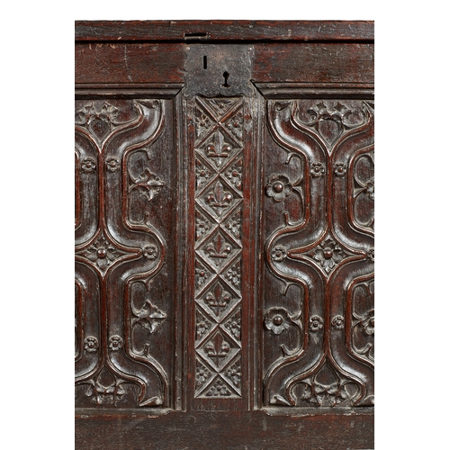 79 - A FINE AND EXTREMELY RARE ENGLISH HENRY VIII OAK PARCHEMIN-CARVED COFFER. CIRCA 1530. The hinged lid... 