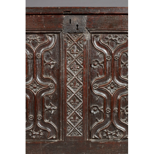 79 - A FINE AND EXTREMELY RARE ENGLISH HENRY VIII OAK PARCHEMIN-CARVED COFFER. CIRCA 1530. The hinged lid... 