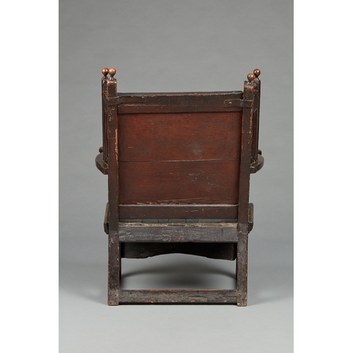 87 - A RARE AND UNIQUE LATE ELIZABETHAN - JAMES I OAK AND POLYCHROME, SLOPED BACK ENCLOSED ARMCHAIR, DERB... 