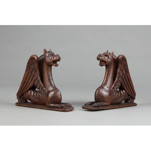 88 - A PAIR OF RENAISSANCE OAK AND POLYCHROME GRIFFINS, NORTHERN FRANCE, CIRCA 15801600. The pair of win... 