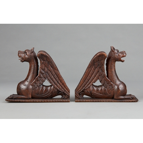 88 - A PAIR OF RENAISSANCE OAK AND POLYCHROME GRIFFINS, NORTHERN FRANCE, CIRCA 15801600. The pair of win... 