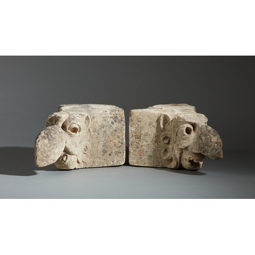 92 - A MID 15TH CENTURY PAIR OF LIMESTONE BEAKED GROTESQUES, ENGLISH, CIRCA 1400-1450. Carved in high rel... 