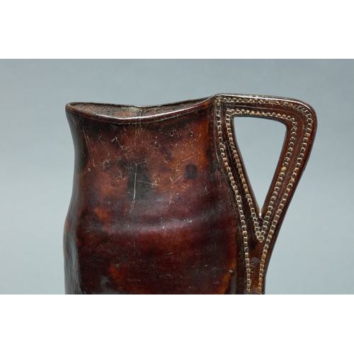 94 - A MID TO LATE 17TH CENTURY LEATHER BLACKJACK ALE JUG, ENGLISH, CIRCA 1660-1680. A finely shaped leat... 