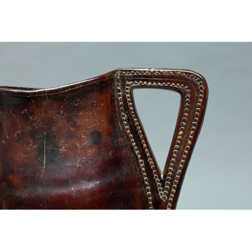 94 - A MID TO LATE 17TH CENTURY LEATHER BLACKJACK ALE JUG, ENGLISH, CIRCA 1660-1680. A finely shaped leat... 