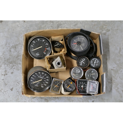 A collection of various gauges and clocks