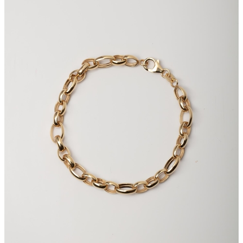 17 - A 9CT GOLD & SILVER BONDED FANCY LINK BRACELET A 19cm long fancy link bracelet crafted in 1/10 9ct y... 