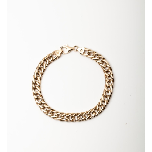 23 - A 9CT GOLD AND SILVER BONDED CRUB BRACELET A 19cm long Curb bracelet crafted in 1/10 9ct yellow gold... 