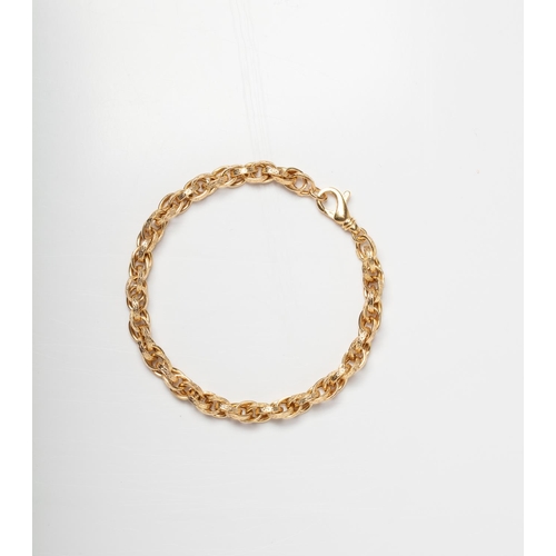 77 - A 9CT GOLD MULTI LINK BRACELET A 19cm long   bracelet with multi textured links crafted in 9ct yello... 
