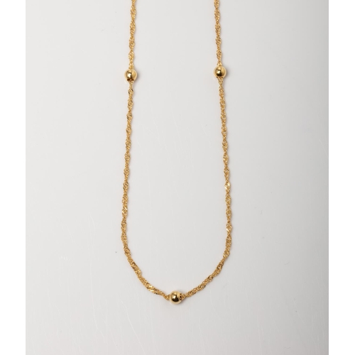 90 - A 14CT GOLD CHAIN WITH BALL ELEMENTS A N/A long Singapore styled  chain with ball detail crafted in ... 