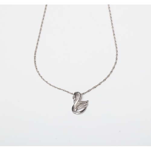 116 - A SILVER DIAMOND SWAN PENDANT ON A 45CM CHAIN Crafted in Sterling Silver set with  Round Diamonds we... 