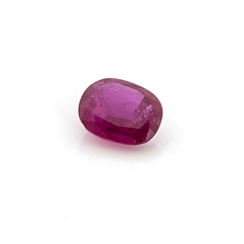 438 - AN UNMOUNTED OVAL MIXED-CUT RUBY