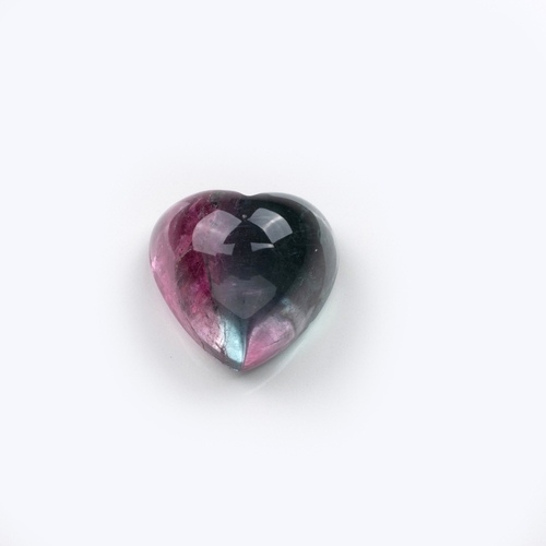 452 - AN UNMOUNTED HEART-SHAPED CABOCHON BI-COLOUR TOURMALINE