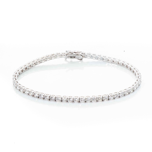 540 - A DIAMOND TENNIS BRACELET