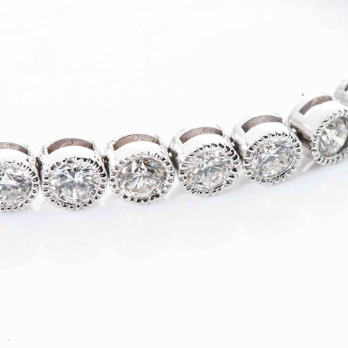 544 - A DIAMOND TENNIS BRACELET