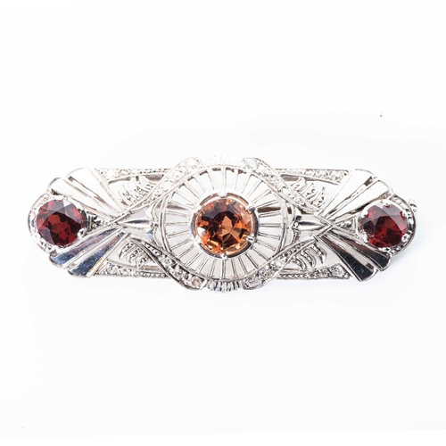 545 - A GARNET AND DIAMOND BROOCH