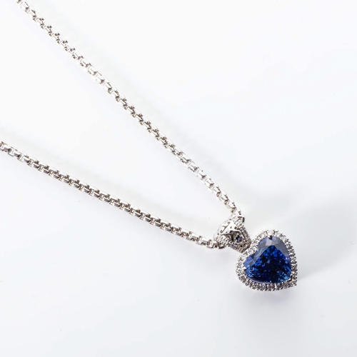 548 - A TANZANITE AND DIAMOND PENDANT