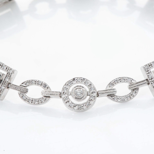 560 - A DIAMOND BRACELET, BROWNS