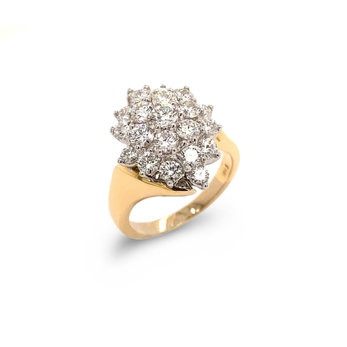 7 - A CLASSIC CLUSTER DIAMOND RING A Classic Cluster Diamond Ring in 18K White and Yellow Gold, set with... 