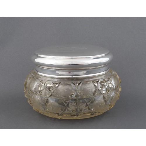 1074 - A CUT GLASS AND SILVER TOPPED DRESSING TABLE JAR, CHARLES MAY AND SONS, LONDON, 1920